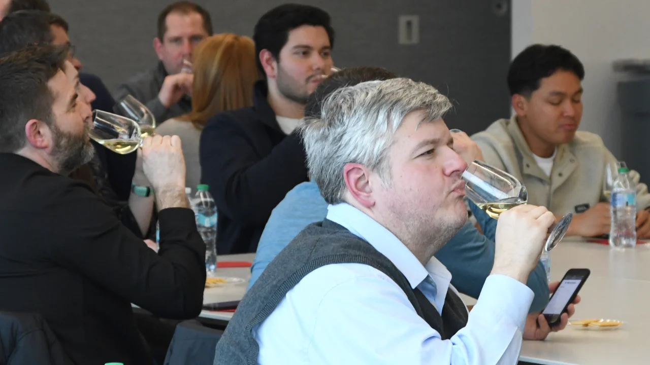 Chemistry of Wine participants tasting a white wine