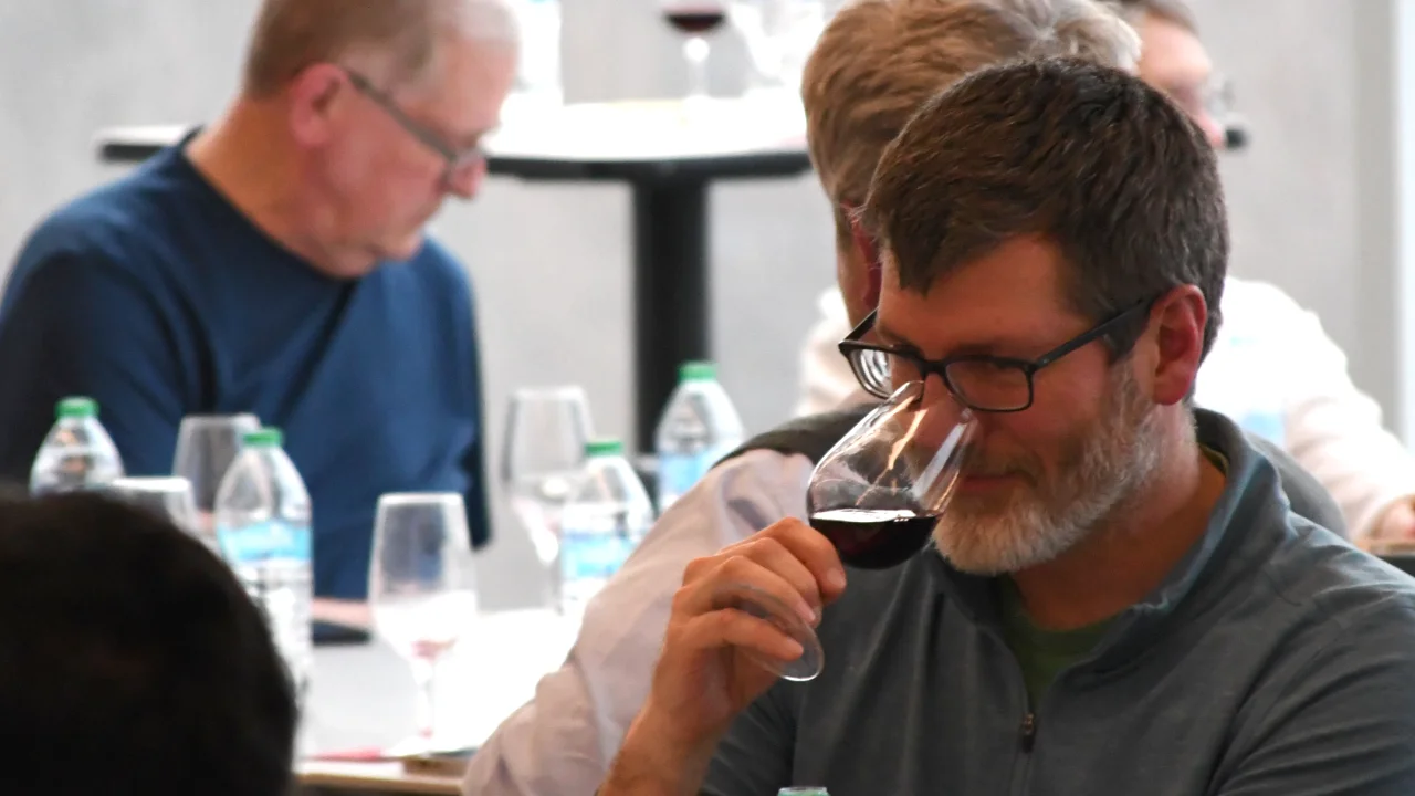 Chemistry of Wine participants sniffing wine to begin aroma analysis
